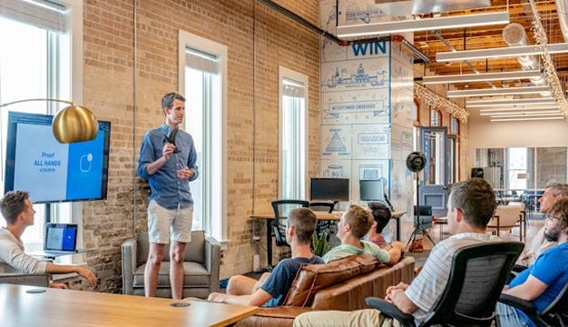 New teachers watching orientation videos created using an AI video creation tool for administrators